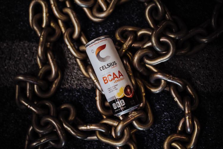 image of a bcaa celsius can on top of chains at the gym